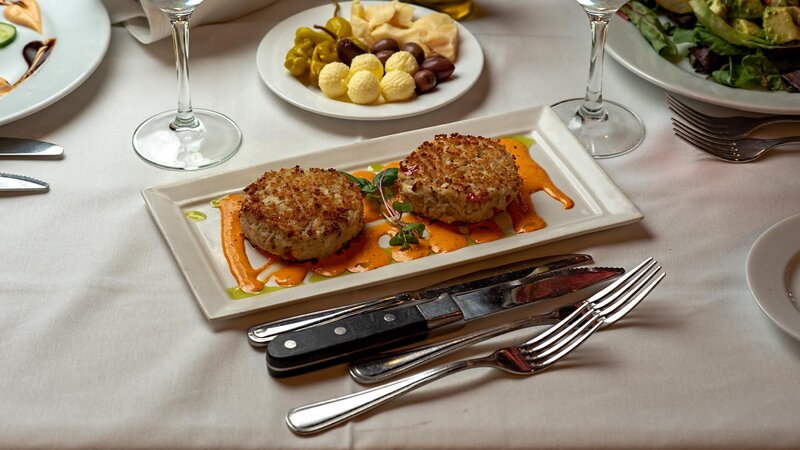 Crab cake appetizer with roasted pepper aioli